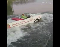 Guy rides convertible into water