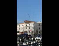 Two people on top of black SUV