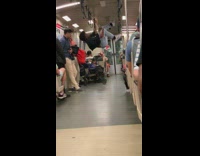 Woman ripped jeans dances and swings on handles on train bruno mars song