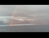 Rainbow on the vast ocean boat trip