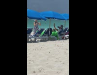 Woman floral dress dance to music beach