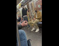 Skater guy in subway wave his skateboard