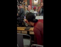 Woman films bar performance in every angle