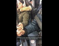 Man and woman hold onto handrail pole and touch hands