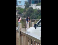 Collab IITW - Three women TikTok dance on the sidewalk