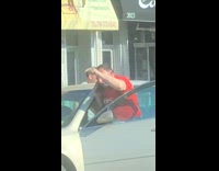Red shirt guy yells into phone car