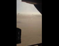Man shows windstorm blowing and whipping sand