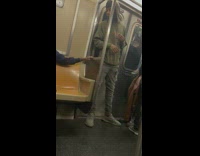 Man stand and talks on other passengers at train 