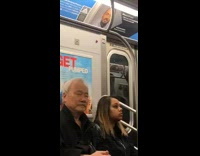 Guy reading newspaper looks like person on subway train advertisement