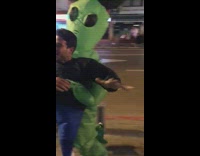 Guy wears a alien abduction costume and pretends he's being kidnapped