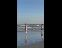 Girl bikini crab claws beach woman stares