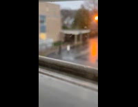 Woman white coat dances outside the rain