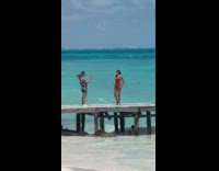 Girl Dances Dance at Beach Pier by Water