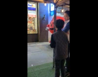 Collab winy - Red inflatable cup mascot walk on street