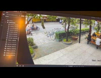 Man watches his motorcycle fail accident outside the restaurant
