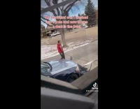 Lady watches boyfriend fix dent in car