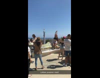 Girl poses for photo on colorful bench