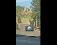 Woman car roof film surroundings road trip