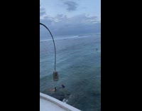 Woman pose sit on beach deep water