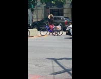 Collab WINY - Man wear feathered headdress dance on street