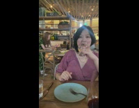 Woman printed dress film food on table