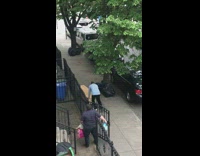 Blue shirt guy pushes rectangular wood box 