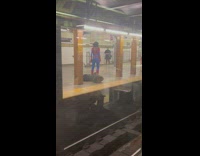 Spiderman with no mask waits for train 