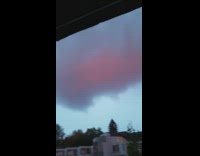 Pink rainbow blue sky grey clouds sunset