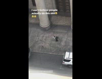 Woman throws newspaper and then danced on the sidewalk