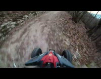 Red ATV collides with van dirt road