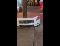 White car front bumper left on street