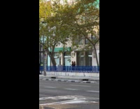 Two women black dress tiktok dance sidewalk