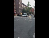 UFO metal spaceship car drives street sunset 