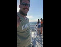 White shirt girl black shorts friend boat 