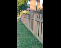 Man sees invisible fence sign hanging on fence 
