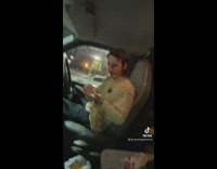 Two people in car have funny interaction about jelly beans