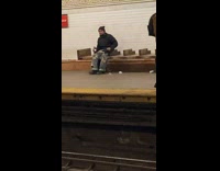 Guy sitting on bench talks to himself 
