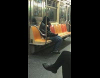 Two men smoke on subway train