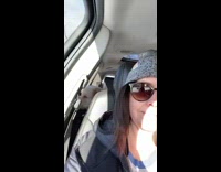 Woman film dog bark at inflatable bear