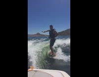 guy wakeboarding catches dink and drinks it 