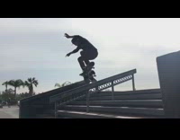 Collab ShredSlams - Skateboarder grinds handrail and almost does the splits after falling off