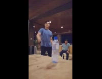 Blue shirt guy flips water bottle night