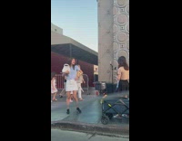 Woman white skirt promote bags on street