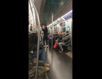 Guy in purple durag contorts his body and dances on subway train
