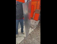 Guy waves thin metal sheet 