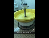 Guy trying to figure out how to use old yellow round sink
