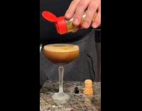 Man puts curry powder on his drink