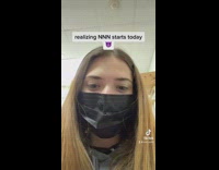 GIrl black mask looking at camera