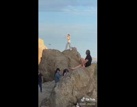 Two women bikini yoga exercise beach rocks Part 2