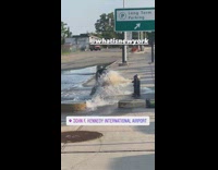 Man has his head down on fire hydrant water